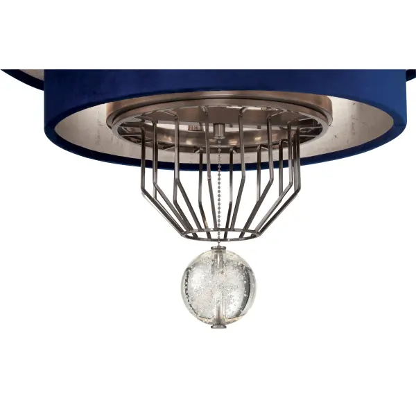 The Grandeur pendant combines timeless elegance with luxurious materials. Eight candelabra lights illuminate through a sophisticated blue velvet drum shade, while crystal accents and aged antique nickel finish add refined detail. - alternate view