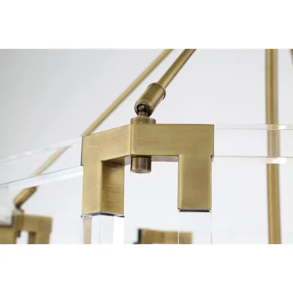 The Prima Vista chandelier combines classic elegance with contemporary sensibility. Its aged antique brass finish and 8-light configuration deliver substantial illumination while the acrylic accents soften the overall aesthetic. - alternate view