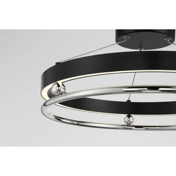 The Grande Illusion pendant combines modern aesthetics with high-performance LED technology. Its 21.25-inch profile delivers 1203 lumens with a superior 92 CRI, ensuring true color rendering. The polished nickel and coal finish adds sophisticated contrast. - alternate view