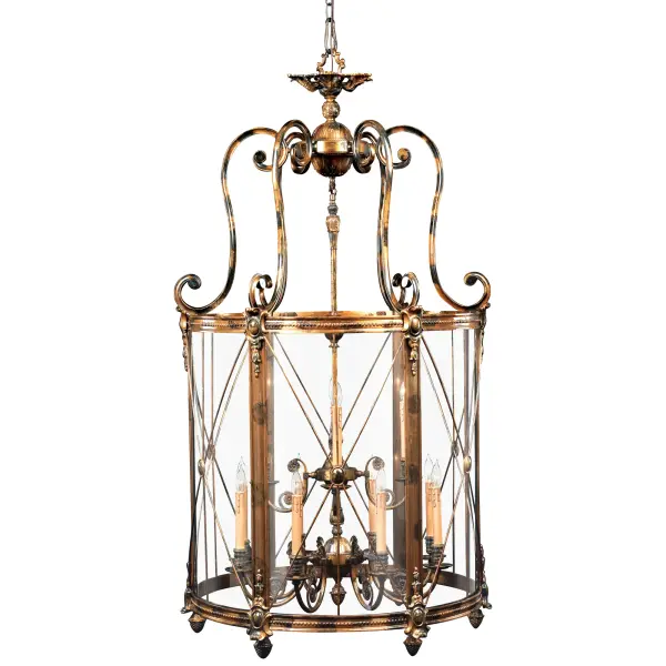 This impressive 12-light foyer pendant combines Old World craftsmanship with transitional elegance. Handcrafted in Italy with brass construction and oxide bronze finish, it creates a stunning focal point in grand entryways and staircases.