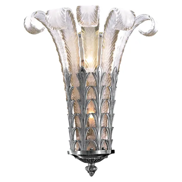 This artisan-crafted wall sconce combines solid cast brass construction with hand-shaped white Murano glass, creating a sophisticated lighting statement. The platinum finish and Spanish craftsmanship deliver timeless appeal.