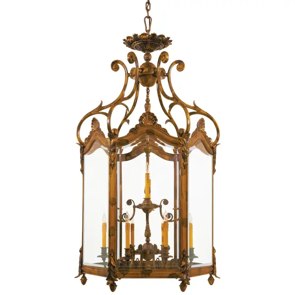 This handcrafted Spanish foyer pendant commands attention with 12 candelabra lights and clear beveled glass panels. The substantial 35-inch width and oxide bronze finish create an elegant focal point perfect for two-story spaces.