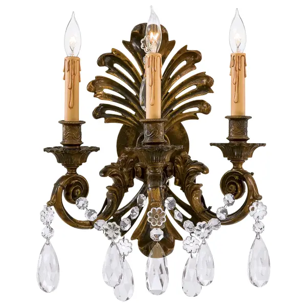 This exquisite wall sconce combines Old World craftsmanship with transitional design. Handcrafted in Italy with solid cast construction and oxidized brass finish, it features authentic Bohemian crystals that add refined sparkle to any space.