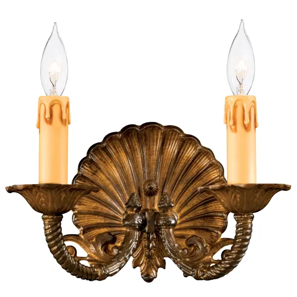 This artisanal wall sconce showcases exceptional Spanish craftsmanship with lost wax cast arms and faceplate. The oxide brass finish adds warmth and sophistication to transitional spaces, perfect for intimate lighting needs.