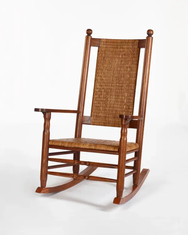 Beloved by John F. Kennedy to relieve back pain from a lingering war injury. The seat & back offer firmness & natural spring through the use of woven cane.