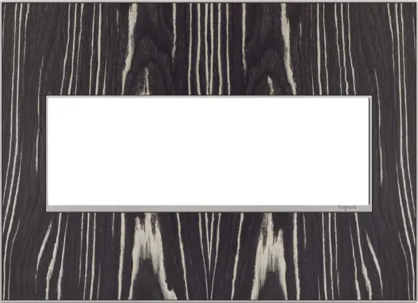 Beautiful and exotic ebony wood, and guaranteed to enhance the look and atmosphere of any room. A 3-Gang Wall Plate, it is perfectly sized to fit any combination of up to three standard-sized adorne devices, or up to six half-sized adorne designer switches and outlets. Collection: adorne Finish: Macassar Width: 7.06" Height: 5.13" Length: 0.35" Weight: 0.59 lb Extension from Wall: 1.00" Material: Real Materials Country of Origin: Mexico Connection: Screwless Manufacturer Warranty: Limited Lifetime