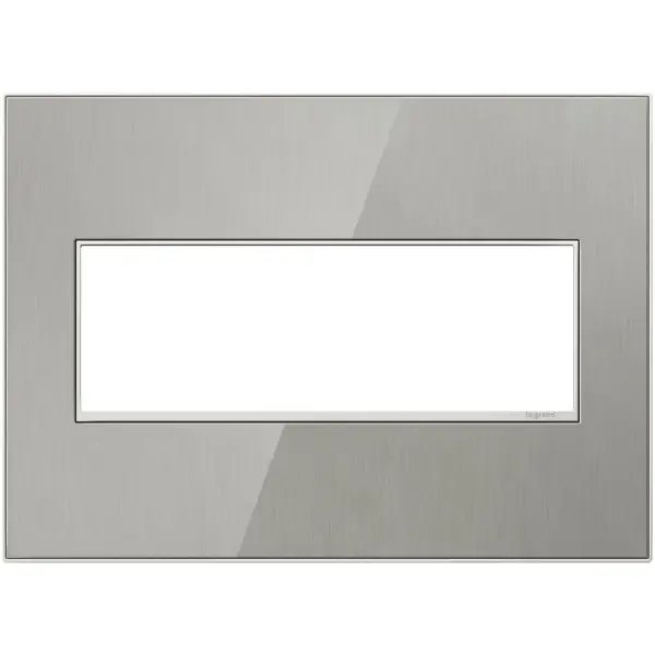 Stainless surface with satin nickel frame, for a trendy industrial touch that€s also sophisticated. A 1-Gang Wall Plate, it is perfectly sized to fit a standard-sized adorne device, or any combination of two half-sized adorne designer switches or outlets. Collection: adorne Finish: Brushed Stainless Notes: Brushed Stainless 3 Gang Wp Width: 7.06" Height: 5.13" Length: 0.35" Weight: 0.98 lb Extension from Wall: 1.19" Bulb Type: tbn Material: Real Materials Country of Origin: Mexico Connection: Screwless Manufacturer Warranty: Limited Lifetime