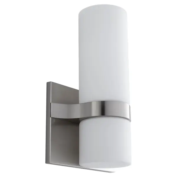 The Olio Large Wall Sconce delivers sculpted simplicity with its curved metalwork and white opal glass diffuser. Perfect for modern interiors seeking understated sophistication and warm ambient lighting.