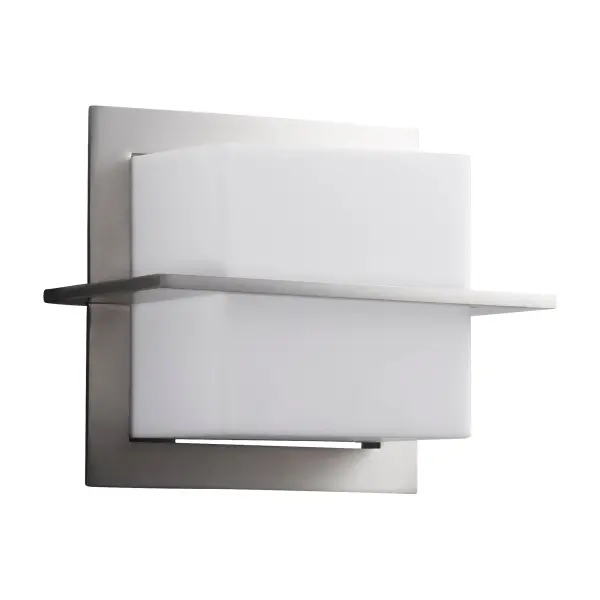 The Metrix wall sconce exemplifies minimalist design with crisp architectural lines and frosted acrylic diffusers. Its compact form delivers warm, structured illumination perfect for modern bathrooms, hallways, and entryways.