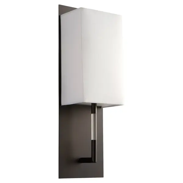 The EPOCH wall sconce combines sharp geometric design with soft fabric diffusion for a sophisticated modern aesthetic. Its 4000K color temperature provides neutral white light ideal for task and ambient lighting.