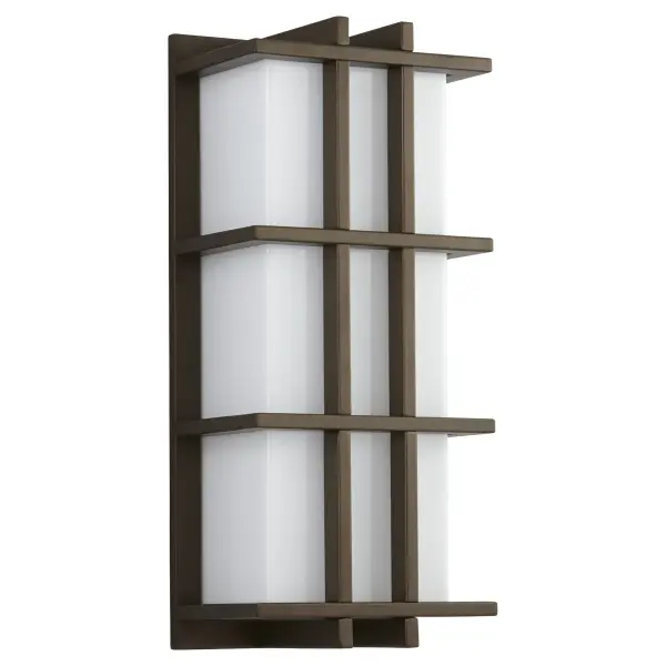 The Telshor Small wall sconce delivers striking modern architecture with vertical fins and warm LED illumination. Wet-rated and dimmable, it combines durability with sophisticated style for outdoor spaces.